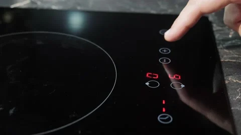 Turning on the sensor electric cooker. Stock Footage 143962722