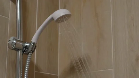 Turning on shower head in bathroom Stock Footage 157545741