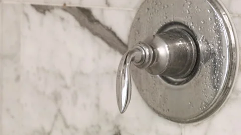 Turning Shower Knob On and Off Stock Footage 130681555