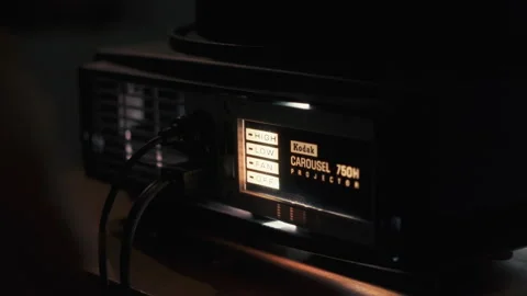 Turning on a slide projector Stock Footage 221786797