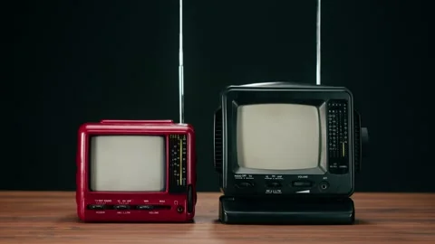 Turning on small old televisions with grey interference screen on black Stock Footage 169114953