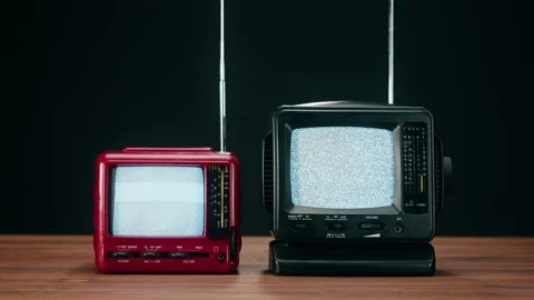 Turning off small old televisions with grey interference screen on black 스톡 동영상 169309423