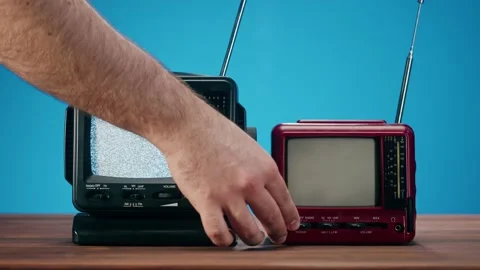 Turning off small old televisions with grey interference screen on blue Video stock 169372992