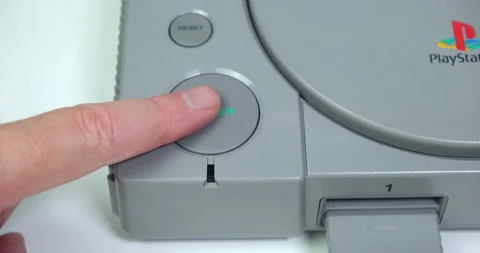 Turning on Sony PlayStation games console. Close up. 動画素材 161631809
