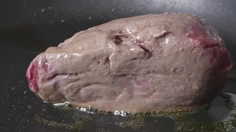 Turning Steak in Pan Stock Footage 169612370