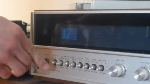 Turning on a Stereo Stock Footage 34532810