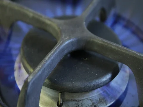 Turning on a stove to cook dinner Stock Footage 74239562