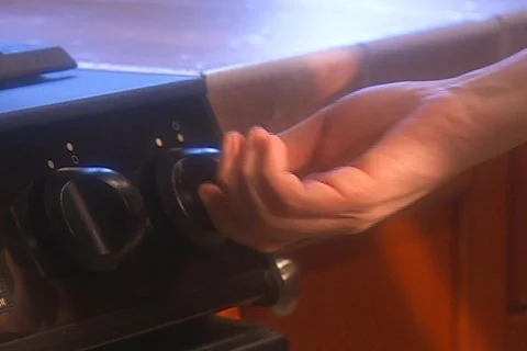 Turning stove knob   Stock Footage 753288