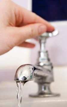 Turning tap Foto stock