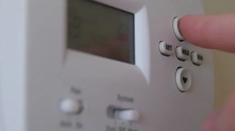 Turning up the temperature on a thermostat Stock Footage 46565825