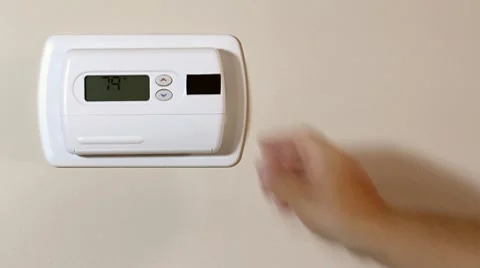 Turning a termostat Stock Footage 8600654