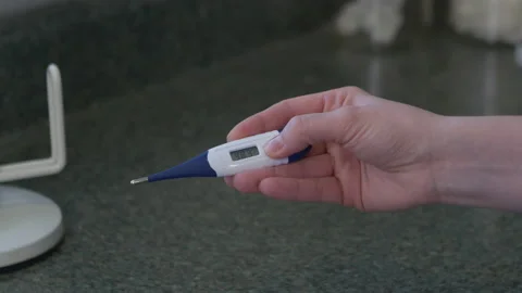 Turning thermometer off Stock Footage 142603690