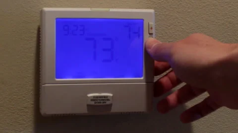 Turning Thermostat Down Stock-Footage 41387935