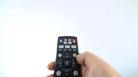 Turning on a TV with a remote control Stock Footage 126946945