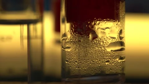 Turning upside down glass flask with liquid in chemical lab Stock Footage 327046770