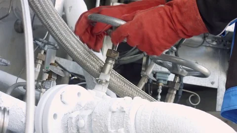 Turning valve in cryogenic pumping system Stock Footage 80460860