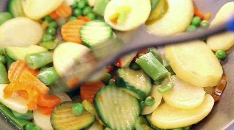 Turning vegetables with spatula Stock Footage 37528226