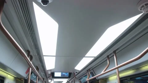 Turning view of metro car ceiling with illumination and displays. subway car Stock Footage 202049224