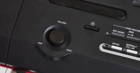 Turning Volume Dial Up and Down on an Electric Keyboard Stock Footage 71214578