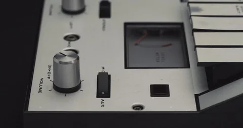 Turning volume knob up button on retro audio cassette tape player recorder Stock Footage 121188567