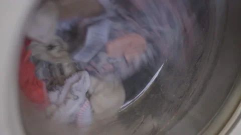 Turning washing machine. Close up shot. Cinematic, side view Stock Footage 152038960