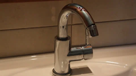 Turning on the water tap Stock Footage 22991892