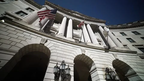 Turning wide angle view looking straight up at the flags and columns of the US Stock Footage 273208624