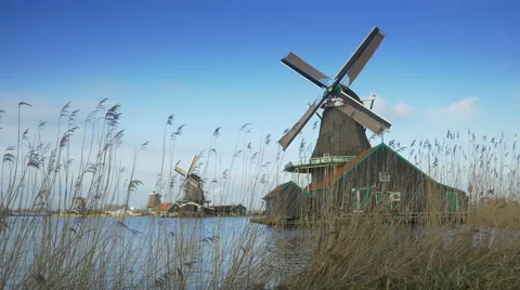 Turning windmills at the Zaanse Schans. Holland Stock Footage