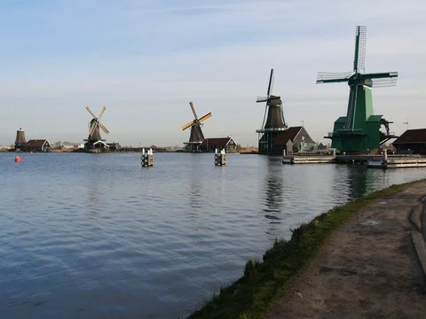 Turning windmills at the Zaanse Schans in Netherlands Stock Footage 73443144