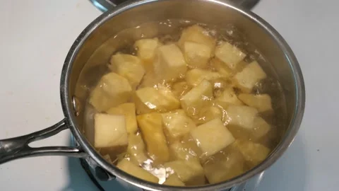 Turnip or rutabaga cubes boiling Stock Footage 219632185