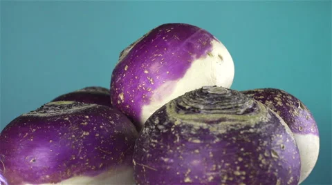 Turnips isolated rotating on blue/green background Stock Footage 62397548