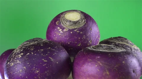 Turnips isolated rotating on green background Stock Footage 62398127