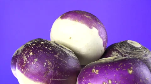 Turnips isolated rotating on purple background Video stock 62399358