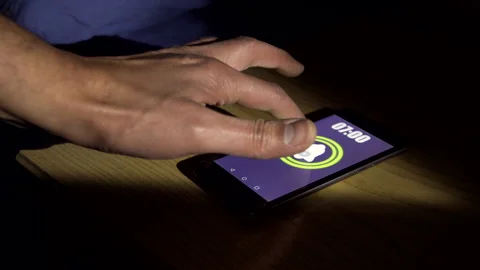 Turns off alarm clock on smartphone Stock-Footage 265605708
