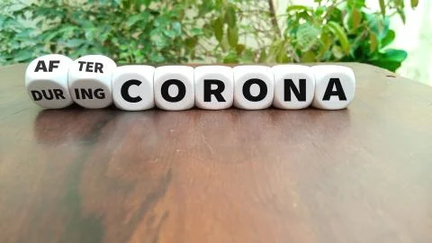 Turns dice and changes the expression during Corona to after Corona Stock Photos