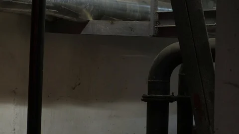 Turns the lamp on the ceiling. Russian hacker in the hat with earflaps speaks on Stock Footage 107326788