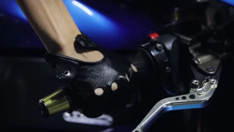 Turns the throttle grip Stock Footage 143219409