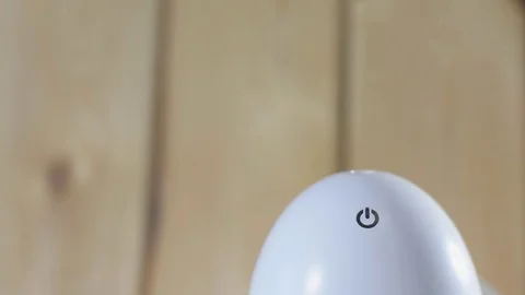 Turns off the white humidifier. Stock Footage 122804846