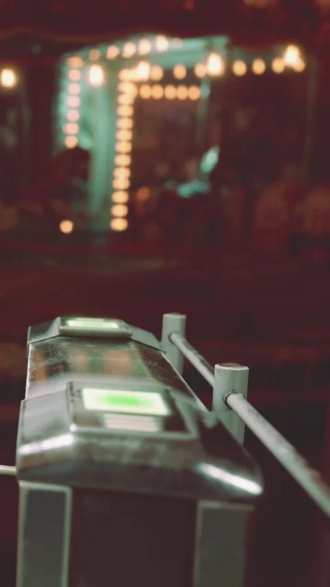 Turnstile in a busy train station during evening hours with glowing lights Stock Footage 341056464