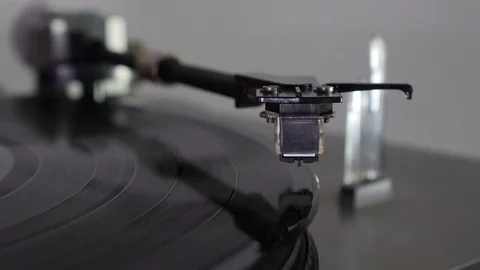 Turntable. The needle falls on a vinyl disc Stock Footage