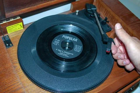 Turntable with old 45 rpm record. Stock Photos