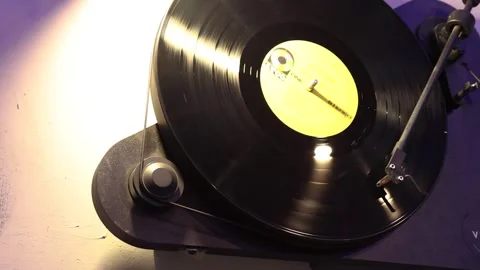 Turntable player, dropping stylus needle on vinyl record playing Stock Footage 241786286
