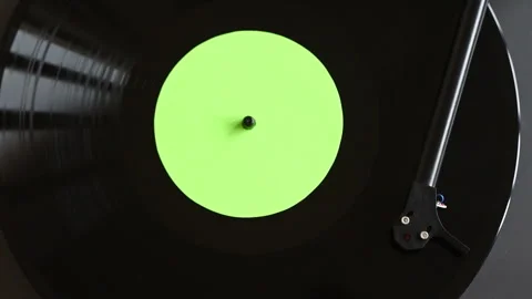 Turntable playing vinyl LP record at home. Blank, empty, green copy space label. Stock Footage 147538966