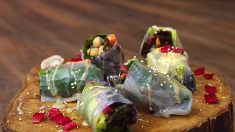 Turntable shot of raw vegan spring rolls 107616230