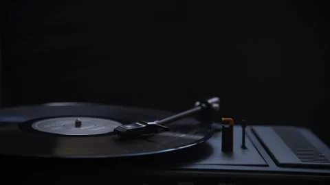 Turntable spinning vinyl record. Closeup of old gramophone playing retro music.  Stock Footage 345741649