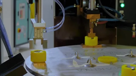 Turntable thread cover spot welding machine with robotic arm manipulator Stock-Footage 347243178