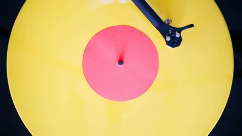 Turntable tonearm play yellow color vinyl record Stock Footage 123700736