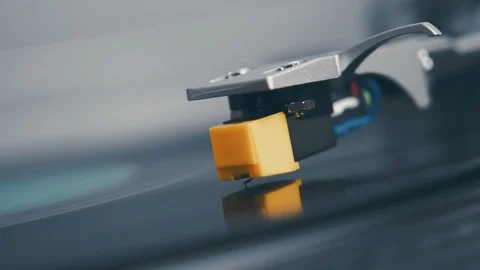 Turntable vinyl record player. The hand of a young man puts a vinyl record Stock Footage 91623379