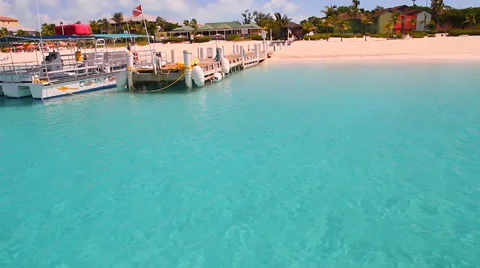 Turqoise blue ocean - boat docking to beachfront - close Stock Footage 37565335
