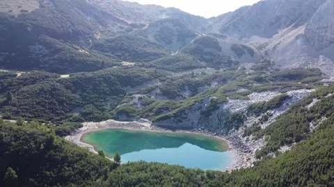 Turquoise Alpine Lake Below Sinanitsa Peak – Pirin Mountains Drone Footage Stock Footage 332012394